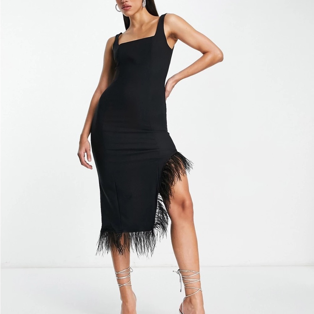 NWT Fitted black dress with feather hem!